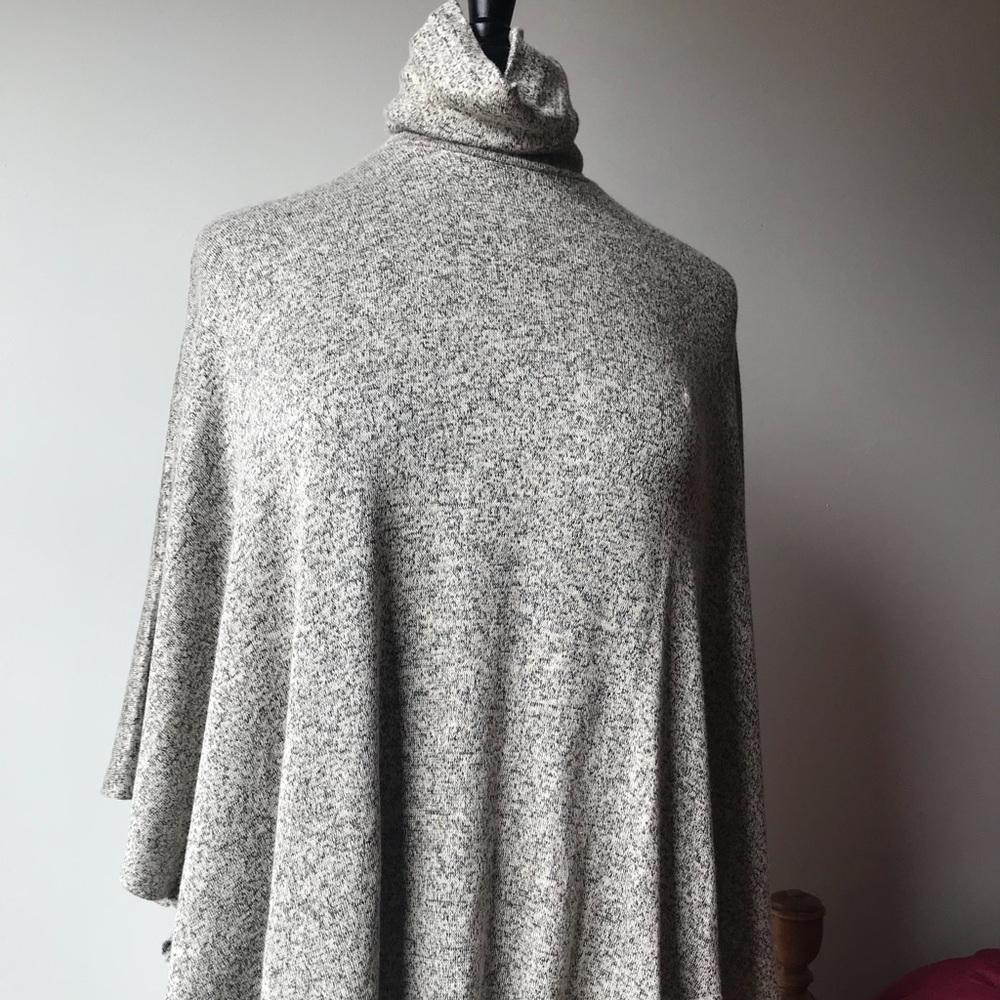 Turtle neck sweater with angel sleeves